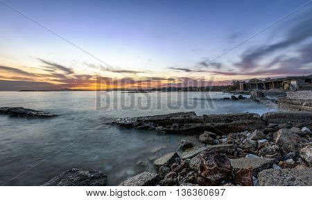 Sunset over the coast of Kavouri, south Athens, Greece