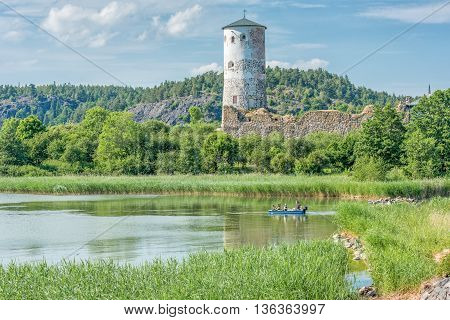 STEGEBORG, SWEDEN - JUNE 25: The bay of Slatbaken and Stegeborg Castle on June 25,2016 in Stegeborg during midsummer in Sweden. Stegeborg is a historic medieval royal castle.