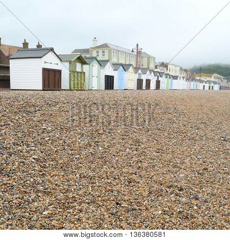Gravel with beach huts on Jurassic Coast in Seaton Devon