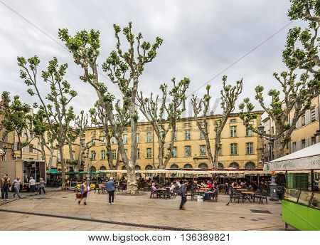 People Enjoy The Spring At The Place De Richelme In Aix-en-provence