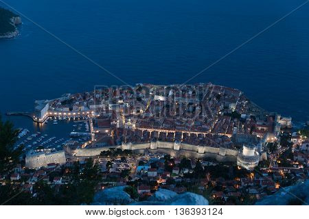 Aerial view of Dubrovnik old town at night from Mount Srd