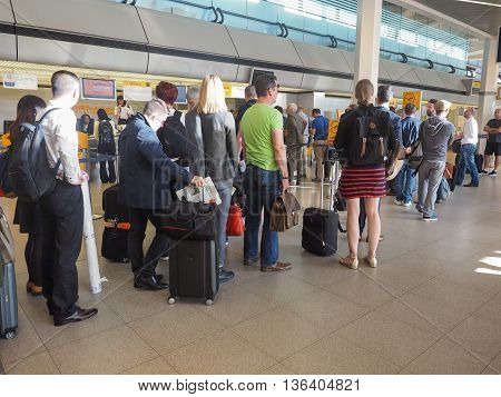 People Queue At Tegel Airport Check-in