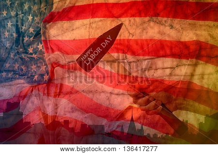 Hand holding hammer with usa flag backgrounddesign for labor day concept.