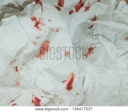 Closeup dried blood on toilet paper background