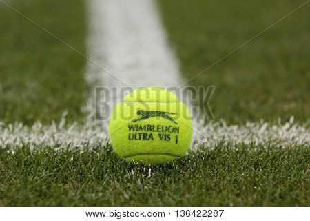 NEW YORK - JULY 21, 2015: Slazenger Wimbledon Tennis Ball on grass tennis court. Slazenger Wimbledon Tennis Ball exclusively used and endorsed by The Championships, Wimbledon