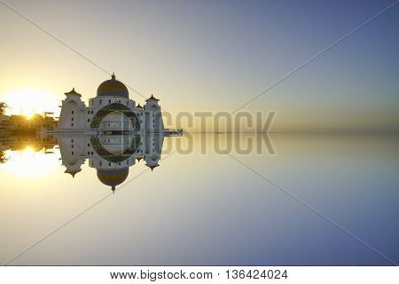 Majestic view of Malacca Straits Mosque during sunset. With copyspace area