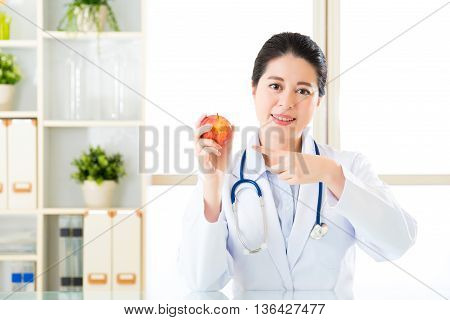 Young Asian Nutritionist Recommend Eating Apple