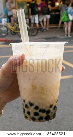 The tasty Taiwanese bubble tea drink (pearl milk tea) at food street market in Taipei, Taiwan.