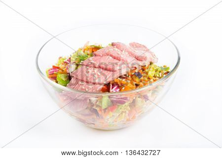Roastbeef salad in a bowl on a white background