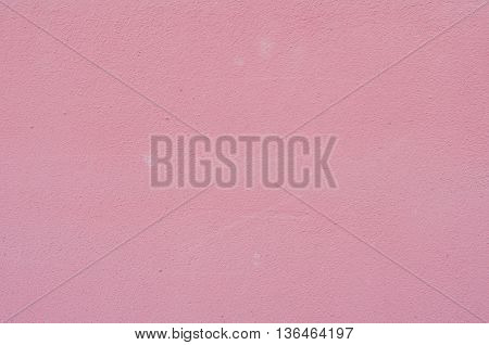 Background of a deep pink (rose-colored) painted wall