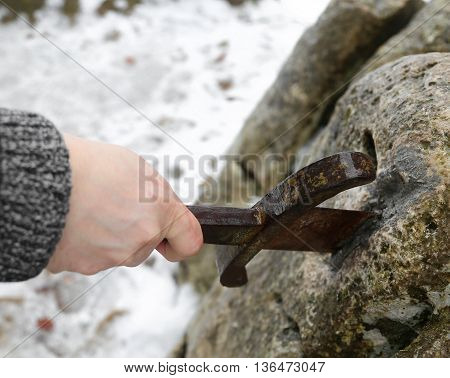 Knight Tries To Remove Excalibur Sword In The Stone