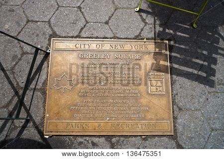 NEW YORK - CIRCA MARCH 2016: metal plate on Greeley Square in New York at daytime. The City of New York is the most populous city in the United States.