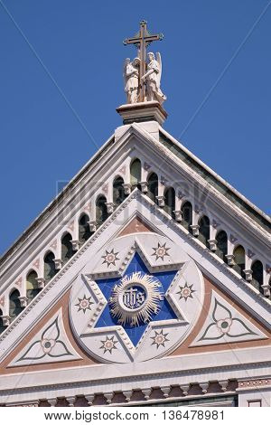FLORENCE, ITALY - JUNE 05: IHS sign, Basilica di Santa Croce (Basilica of the Holy Cross) - famous Franciscan church in Florence, Italy, on June 05, 2015