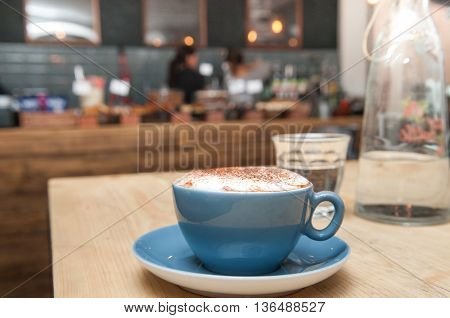 Coffee On A Table In A Busy Cafe