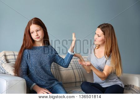 Family problems concept. Mother becalming girl