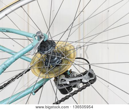 Part of old bicycle wheel derailleur and chain