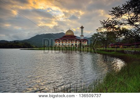 Beautiful view of Darul Quran mosque with reflections during sunset at Kuala Kubu, Selangor, Malaysia.