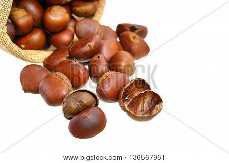 Many chestnuts in small sack isolated on white background