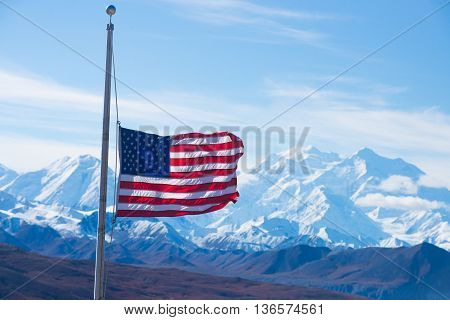 usa flag with mount mckinley in background, denali national park