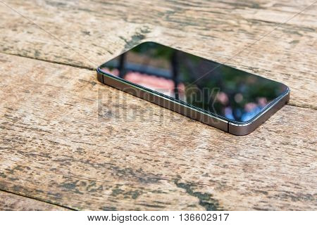 Moblie smart phone on wood table background