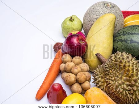Mix colorful asian fruits of red apple dragon fruit lemon watermelon melon papaya durian guava mango cantaloupe rose apple carrot Salacca and southern langsat on isolated / white background