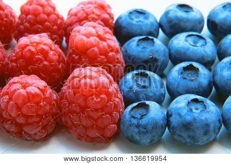 Closeup Of A Bunch Of Raspberries And Blueberries