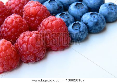 Closeup Of A Bunch Of Raspberries And Blueberries
