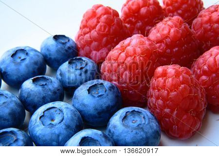 Closeup Of A Bunch Of Raspberries And Blueberries