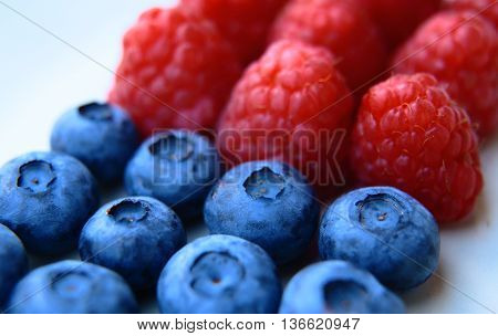 Closeup Of A Bunch Of Raspberries And Blueberries