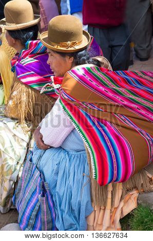 Copacabana Bolivia-March 23 2015:Bolivian women in traditional clothes on the street Copacabana.
