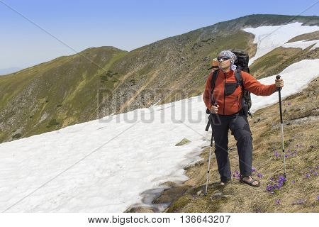 Hiking in the mountains in the summer on a sunny day.