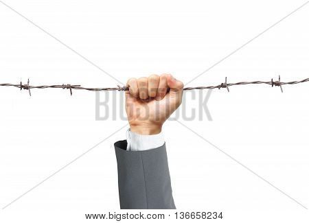 Hand of a businessman holding on a barbed wire - Business risk concept
