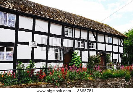 PEMBRIDGE, UNITED KINGDOM - JUNE 5, 2014 - Old former white timber framed cottage hospital along Bridge Street Pembridge Herefordshire England UK Western Europe, June 5, 2014.