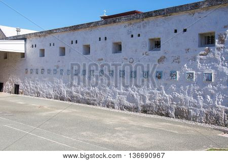 FREMANTLE,WA,AUSTRALIA-JUNE 1,2016:  Numbered exterior painted limestone wall at the Fremantle Prison in Fremantle, Western Australia.