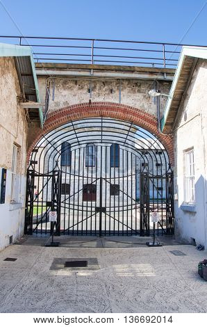 FREMANTLE,WA,AUSTRALIA-JUNE 1,2016:  View through the gate house's arched gateway at the Fremantle Prison in Fremantle, Western Australia.
