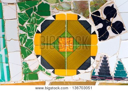 BARCELONA SPAIN - JUNE 10 2014: Detail of ceramic bench in the Park Guell designed by the famous architect Antoni Gaudi (1852-1926). UNESCO World Heritage Site