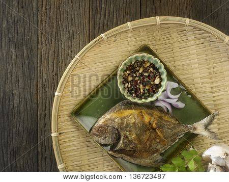 fried black pomfret with chili and sauce