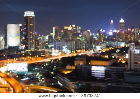 Blurred lights night view, city office building and raod