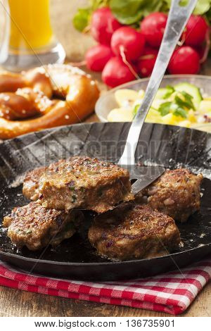 bavarian meatballs in a pan with beer