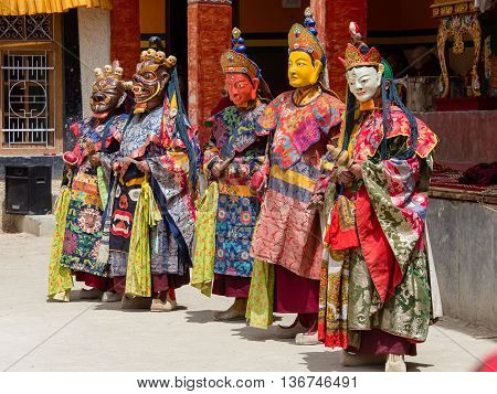 LAMAYURU INDIA - JUNE 13 2015: Unidentified buddhist lamas dressed in mystical mask dancing Tsam mystery dance in time of Yuru Kabgyat Buddhist festival at Lamayuru Gompa Ladakh North India