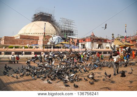KATHMANDU NEPAL - APRIL 18 2016 : Boudhanath stupa under reconstruction after the earthquake on 25 April 2015 Boudhanath is one of famous place in Nepal and the largest ancient stupa in the world.