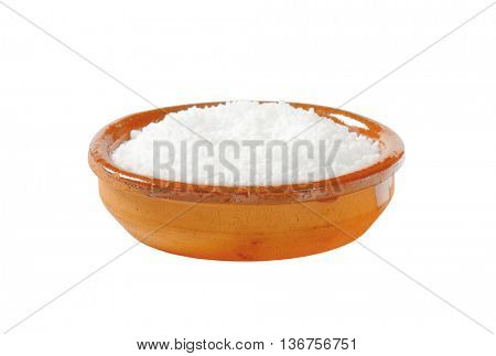 Coarse grained salt in terracotta bowl