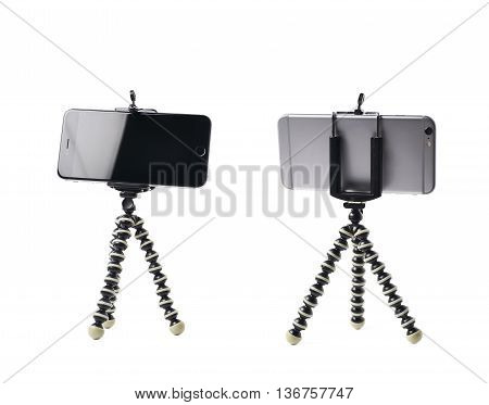 Smartphone set up on a tripod isolated over the white background, set of two different foreshortenings