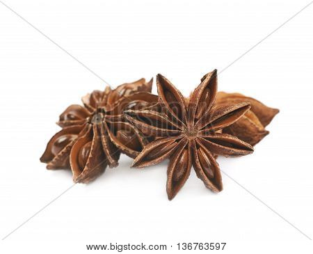 Pile of multiple Chinese star anise seeds, composition isolated over the white background