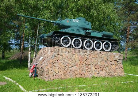 NOVGOROD REGION, RUSSIA - JUNE 02, 2016: Tank T-34-85 on the podium. The monument at the entrance to the city of Old Russa. Historical landmark of the Novgorod region