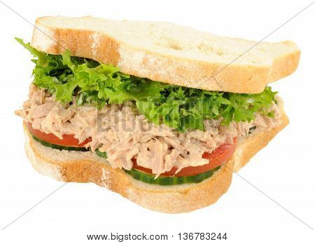 Tuna and salad filled sandwich in thick white sliced bread isolated on a white background