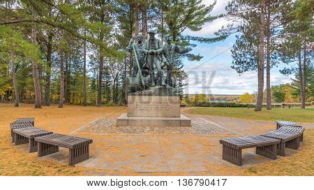 OSCODA MI/USA - OCTOBER 14 2015: Pine needles decorate Lumberman's Monument, on the Highbanks Trail, on the AuSable Scenic Byway, in the Huron National Forest, near Oscoda, Michigan.