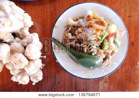 Thai style food on rice in dish zinc