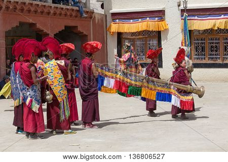LAMAYURU INDIA - JUNE 13 2015: Unidentified buddhist lamas dressed in mystical mask dancing Tsam mystery dance in time of Yuru Kabgyat Buddhist festival at Lamayuru Gompa Ladakh North India