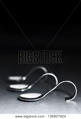 Silver spoons with copy space. Elegant spoons in a row.